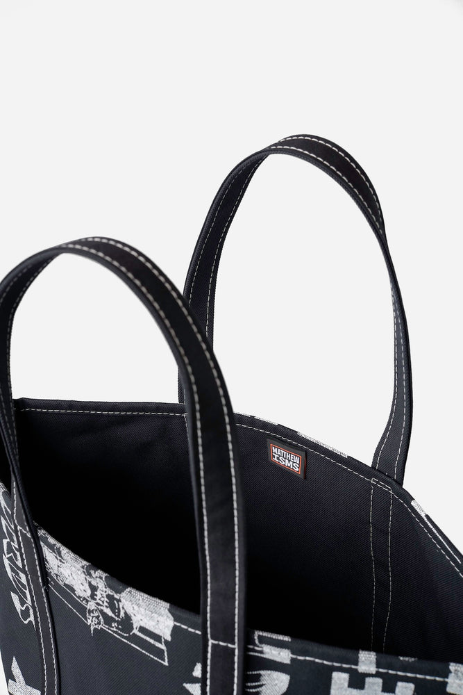 
                  
                    A PATIENT MAN'S ANTICS Canvas Tote Bag / Matthew Miller + Fifth
                  
                